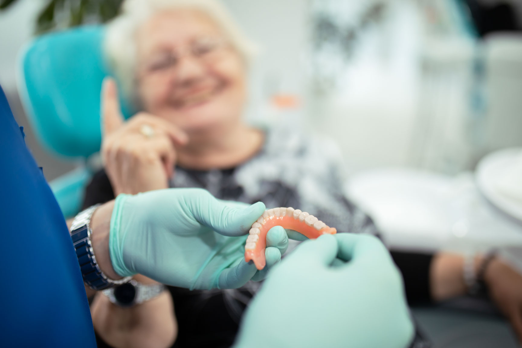 Patient receiving complete dentures