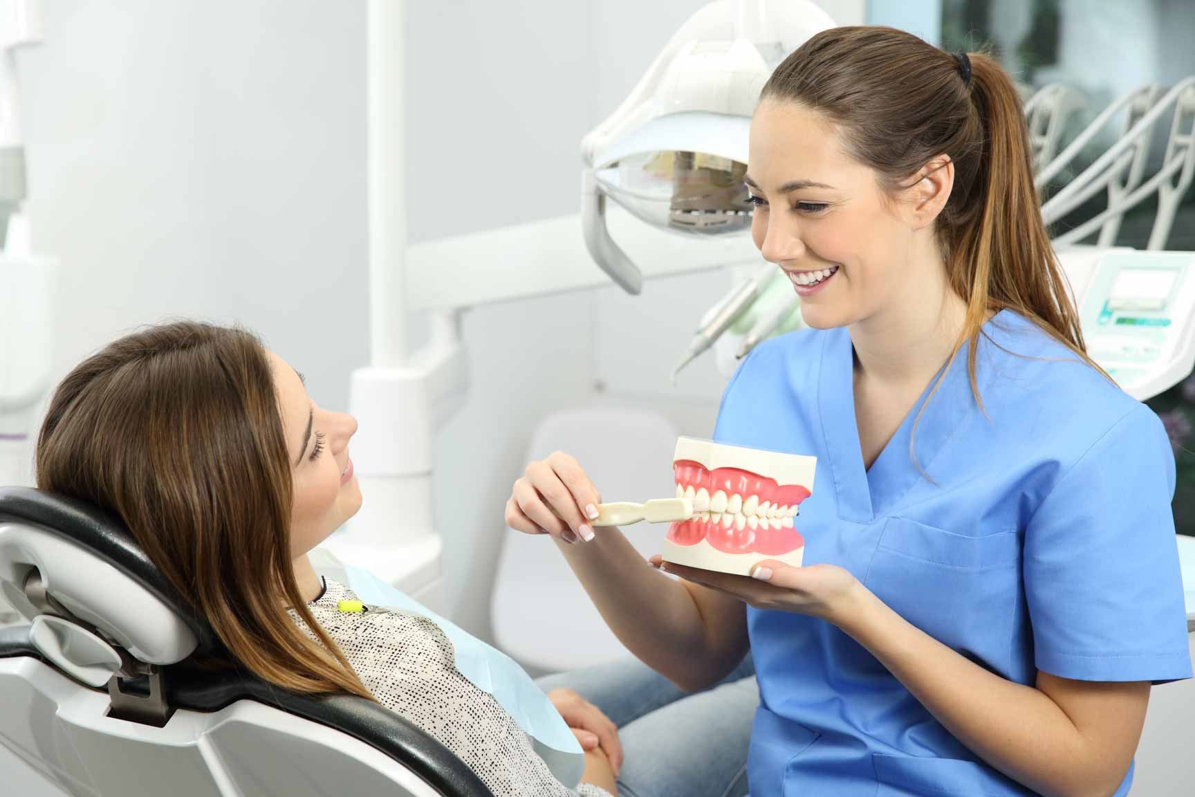 Dental hygienist speaking with a patient